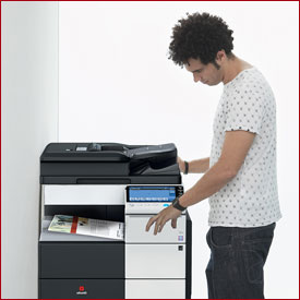 Photo - Man using photocopier - East Pennine Office Equipment.